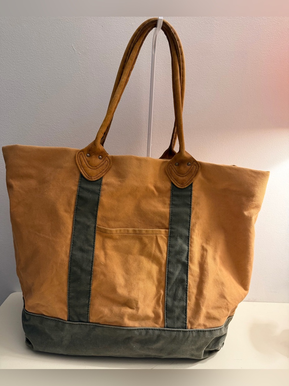 L.L.Bean vintage canvas tote in tan and green with tan leather handles.